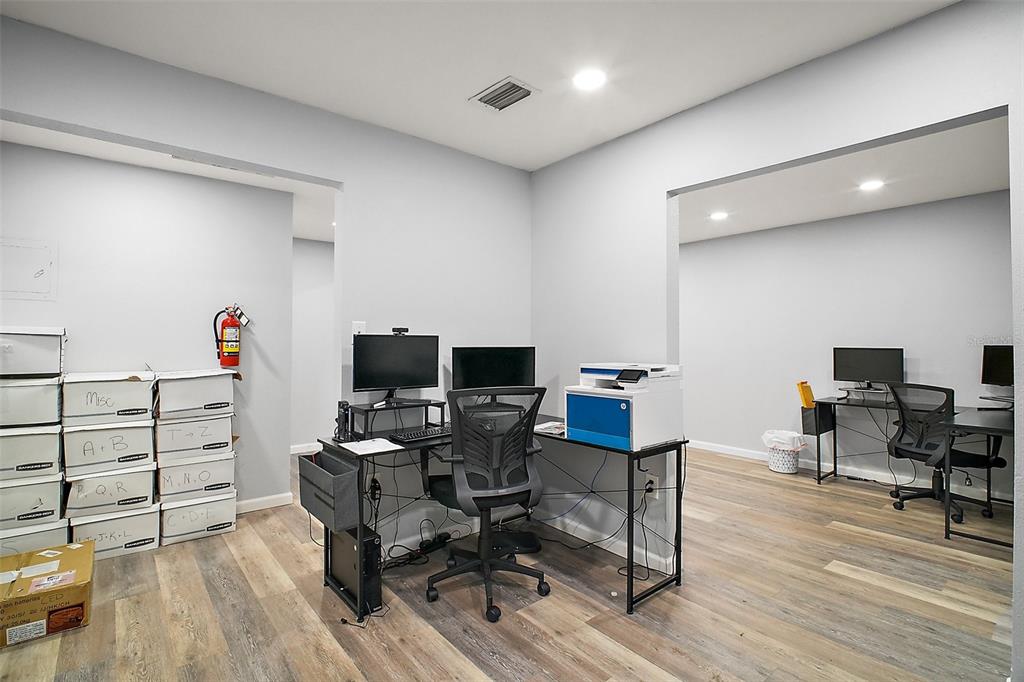 3101 Kurt Street Eustis, FL 32726 - Photo 32 of 43 a view of a workspace with furniture and wooden floor