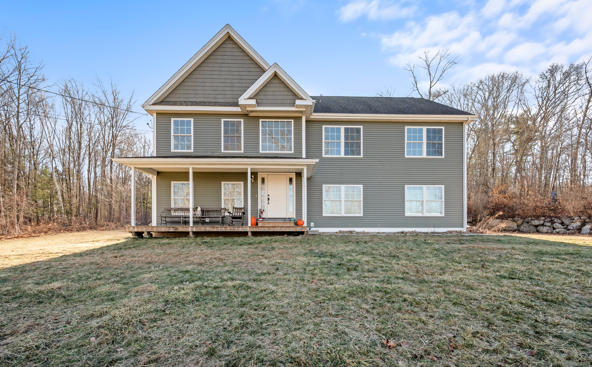 a front view of a house with a yard