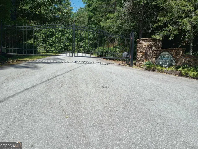 a front view of a building with trees