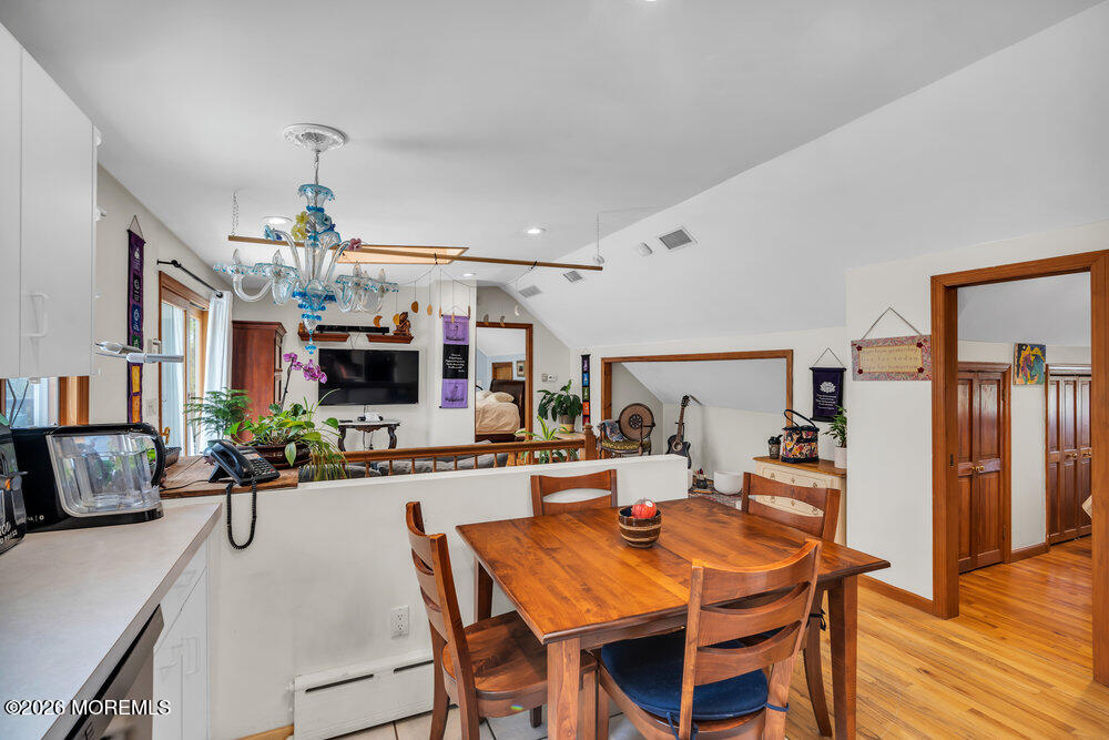 34 State Route Colts Neck, NJ 07722 - Photo 12 of 40 a view of a dining room with furniture and wooden floor