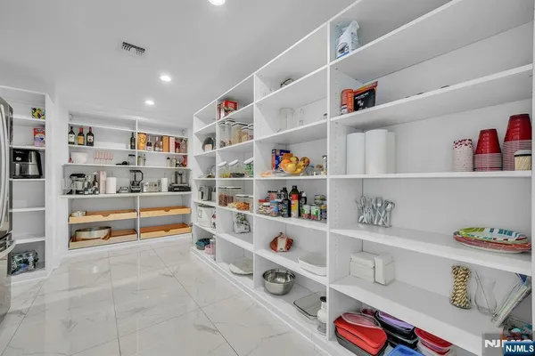 a kitchen with cabinets and window