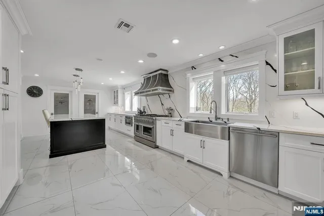 a bathroom with a sink mirror vanity and toilet