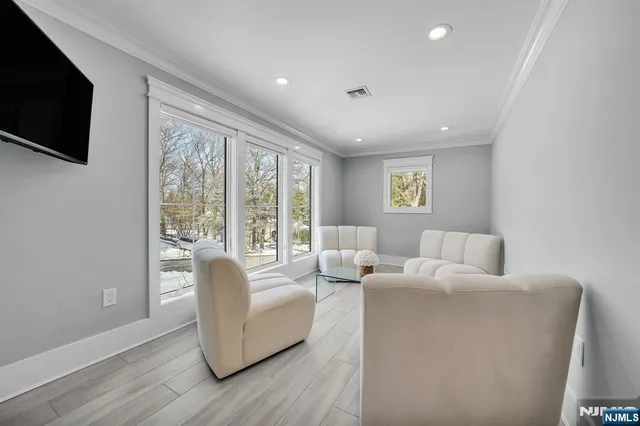 a spacious bathroom with a double vanity sink a mirror and a bathtub