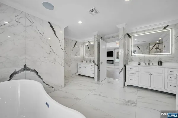 a bathroom with a bathtub and shower