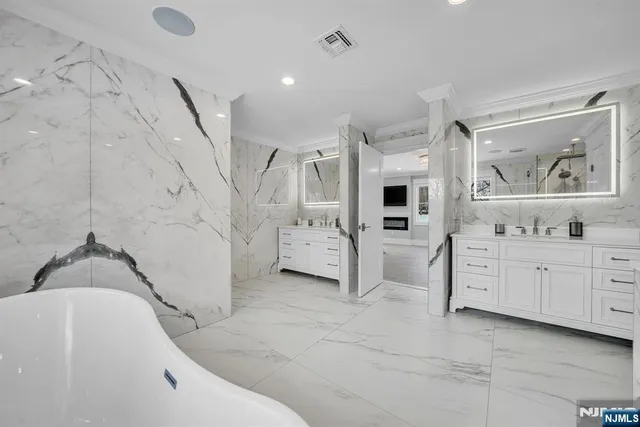 a bathroom with a bathtub and shower