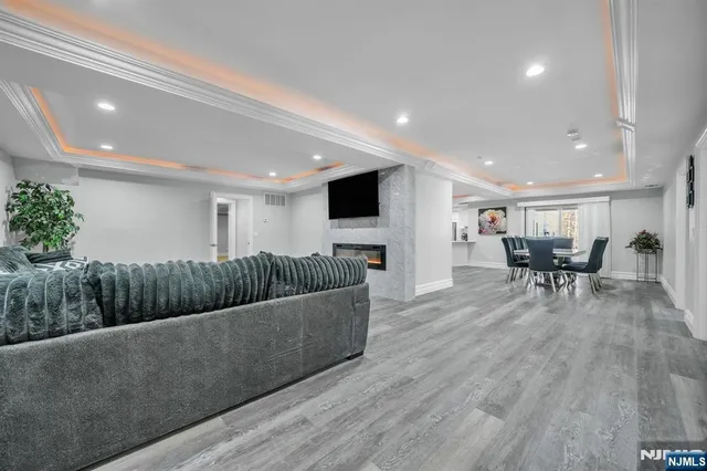 a view of a dining room with furniture and wooden floor