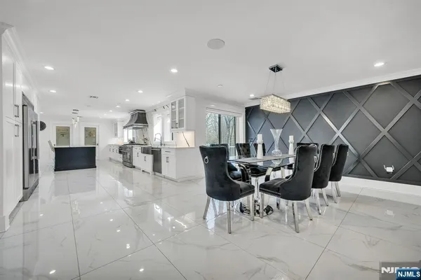 a kitchen with a table and chairs in it