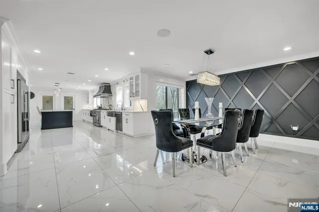 a kitchen with a table and chairs in it