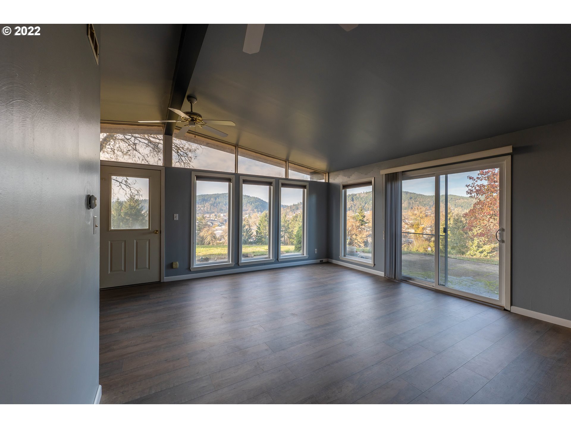 643 South State Street Sutherlin, OR 97479 - Photo 6 of 32 a view of an empty room with a window and wooden floor