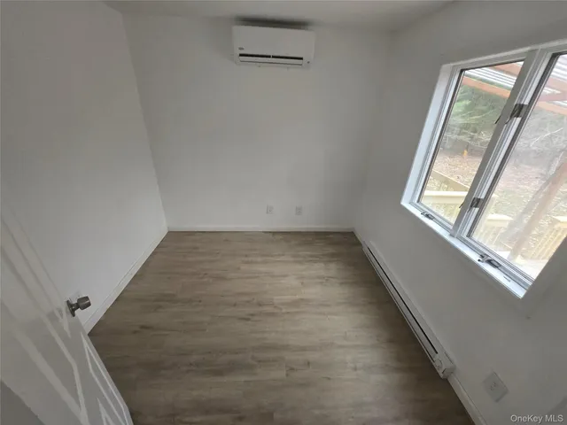 a bathroom with a bathtub and toilet