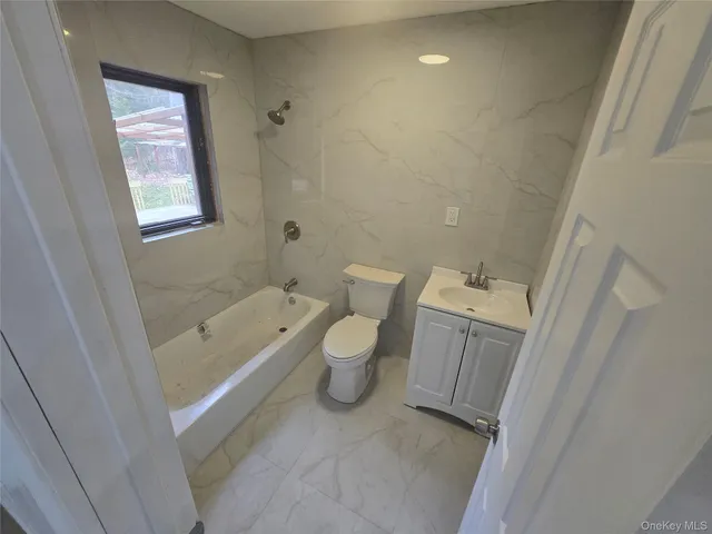 a bathroom with a sink and toilet