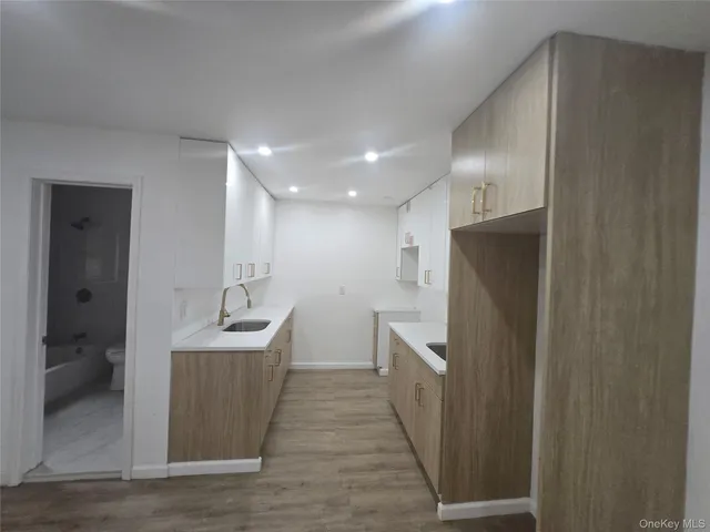 a kitchen with stainless steel appliances a refrigerator and a sink
