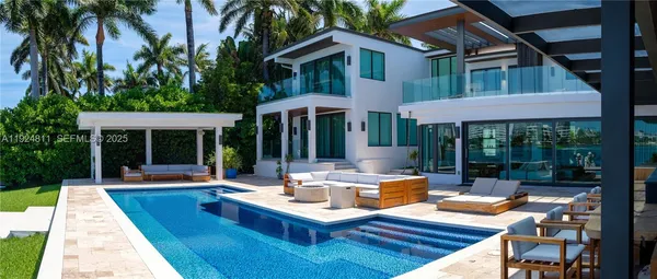 a view of a house with pool table and chairs
