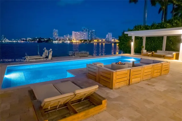 a view of a chairs and tables on the roof deck