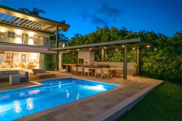 a view of a swimming pool with an outdoor seating