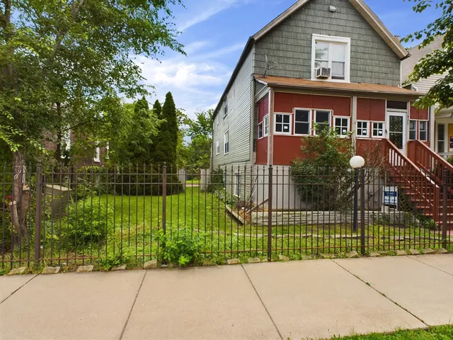 front view of a house with a garden