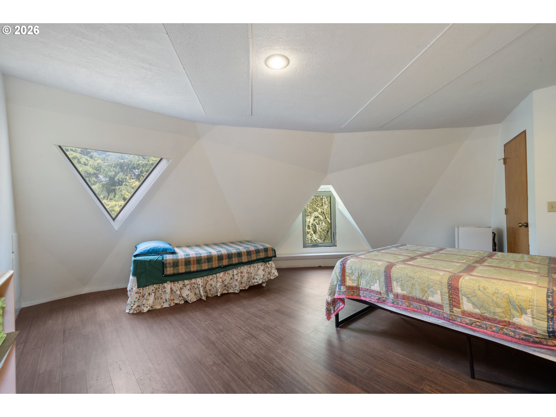 2500 Whiskey Creek Road Tillamook, OR 97141 - Photo 20 of 46 a bedroom with a bed table and window