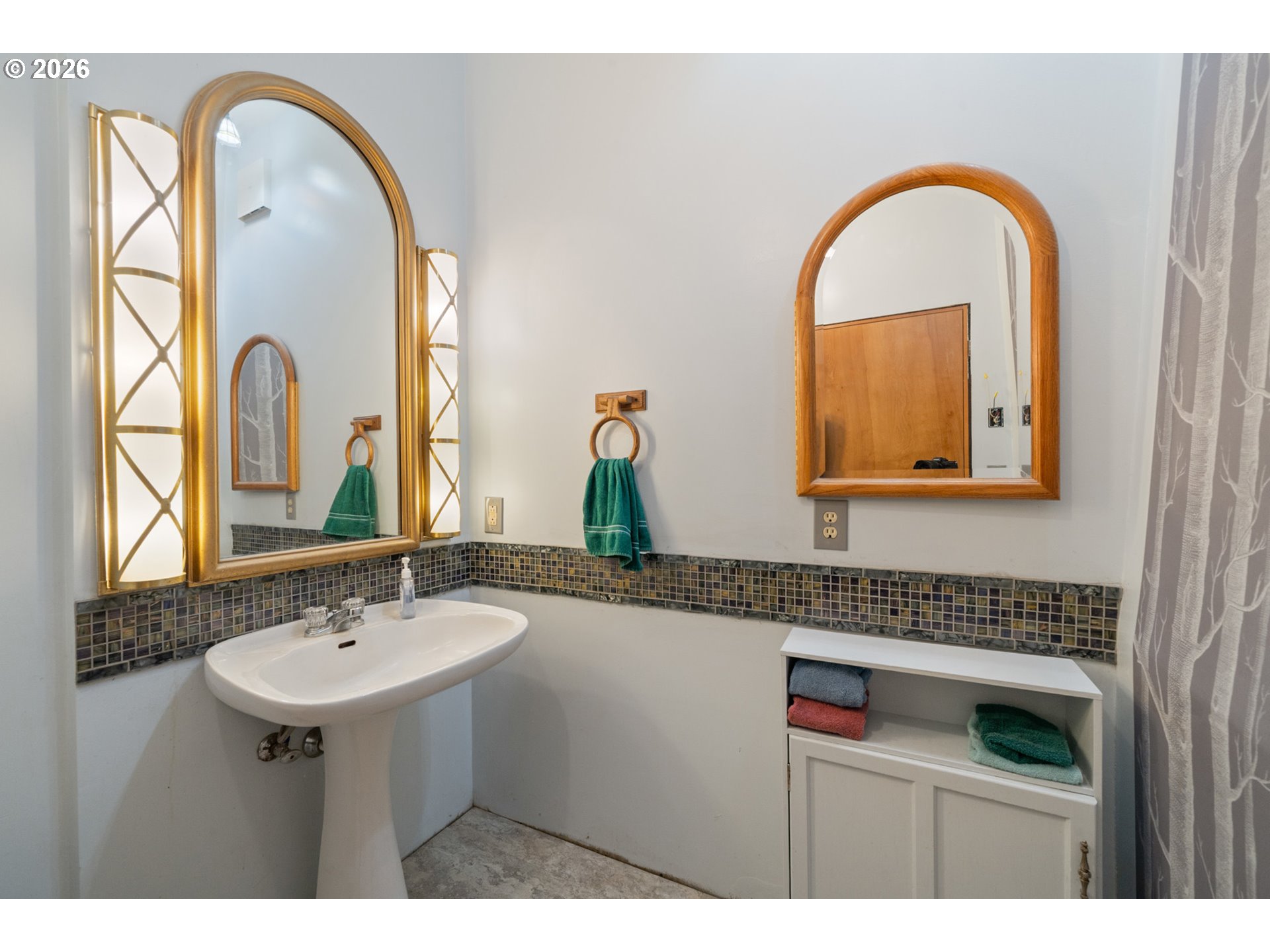2500 Whiskey Creek Road Tillamook, OR 97141 - Photo 22 of 46 a bathroom with a sink and a mirror