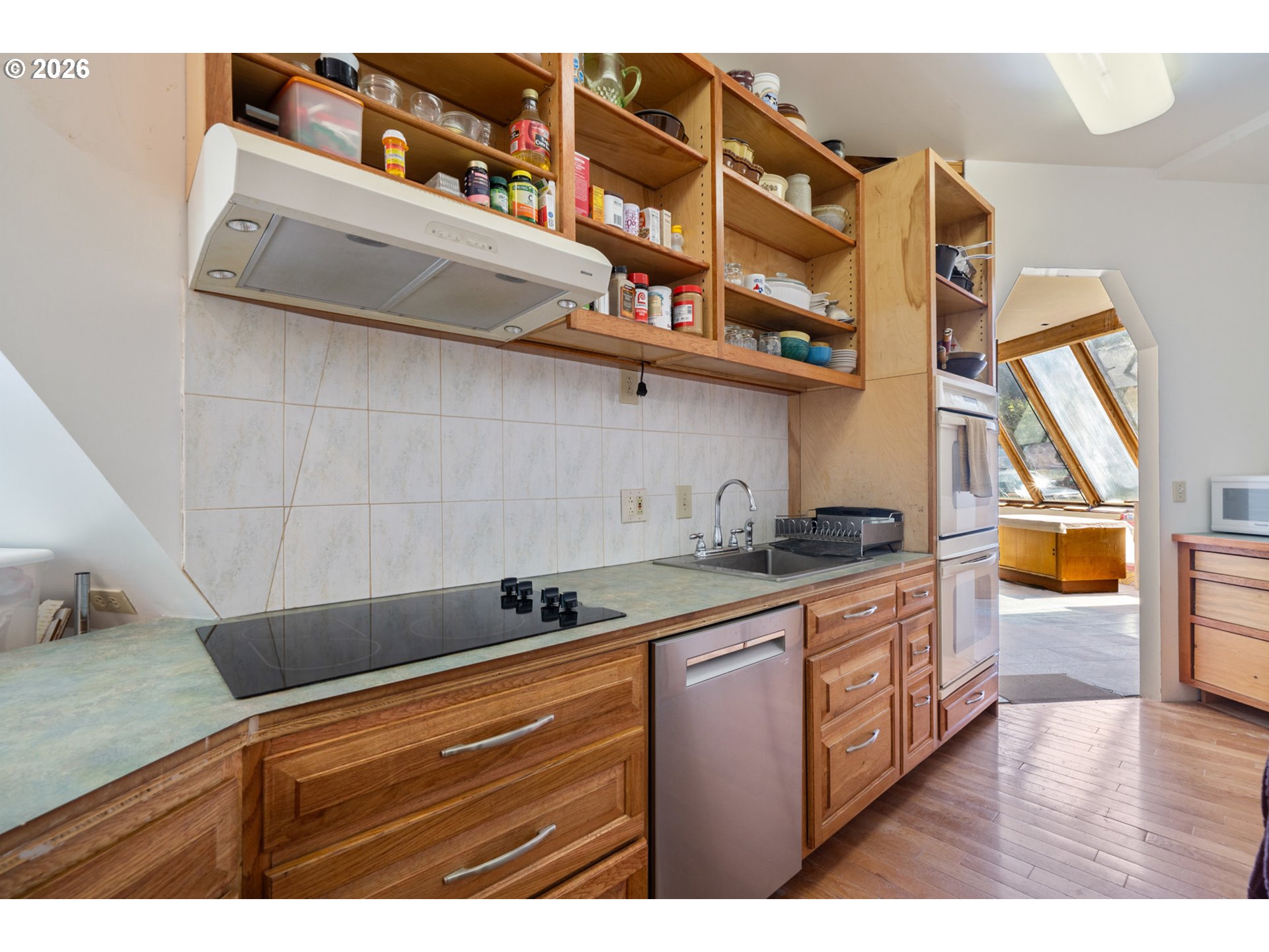 2500 Whiskey Creek Road Tillamook, OR 97141 - Photo 27 of 46 a kitchen with stainless steel appliances granite countertop a sink and cabinets