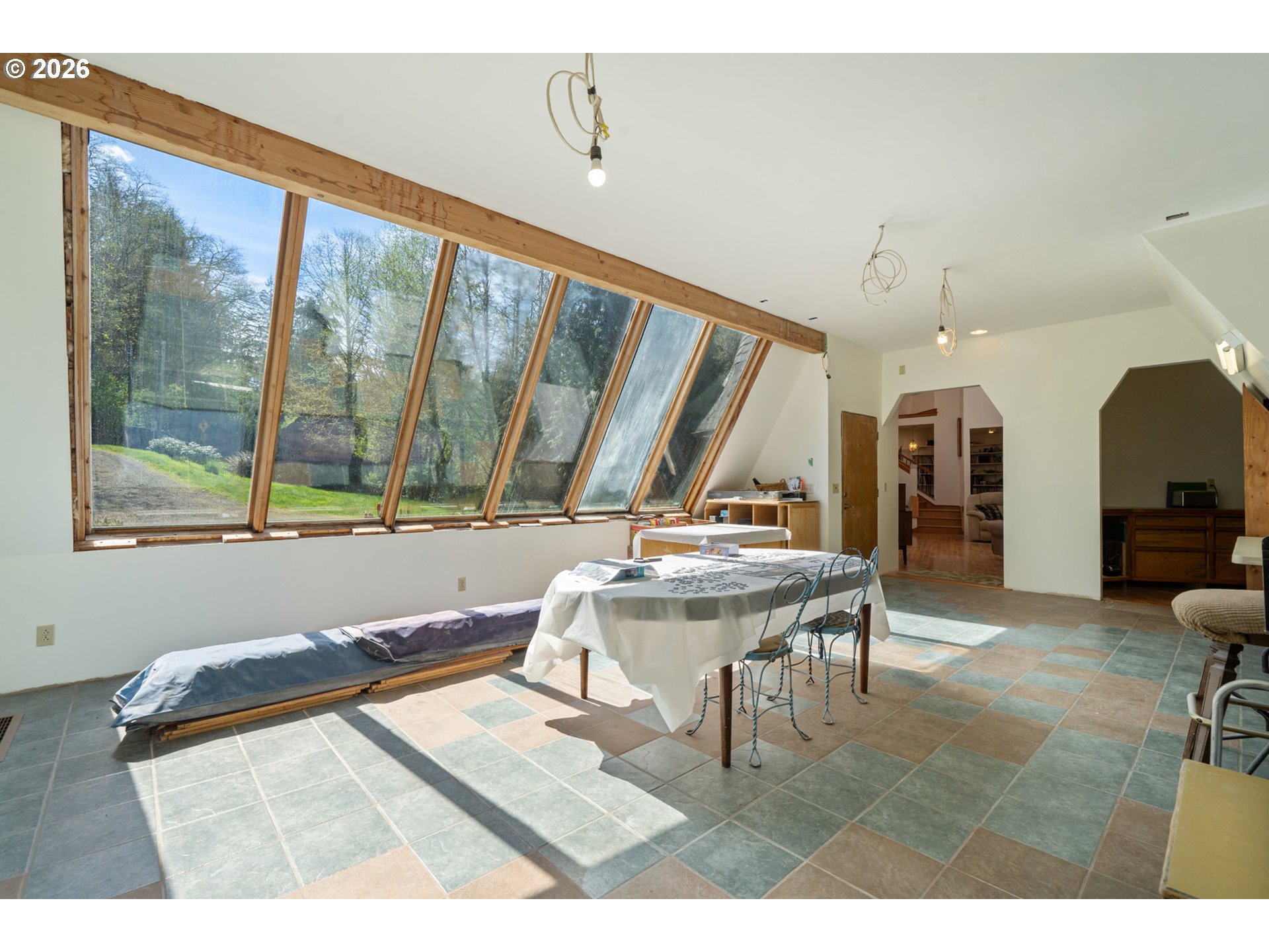 2500 Whiskey Creek Road Tillamook, OR 97141 - Photo 29 of 46 a living room with a table chair and a large window