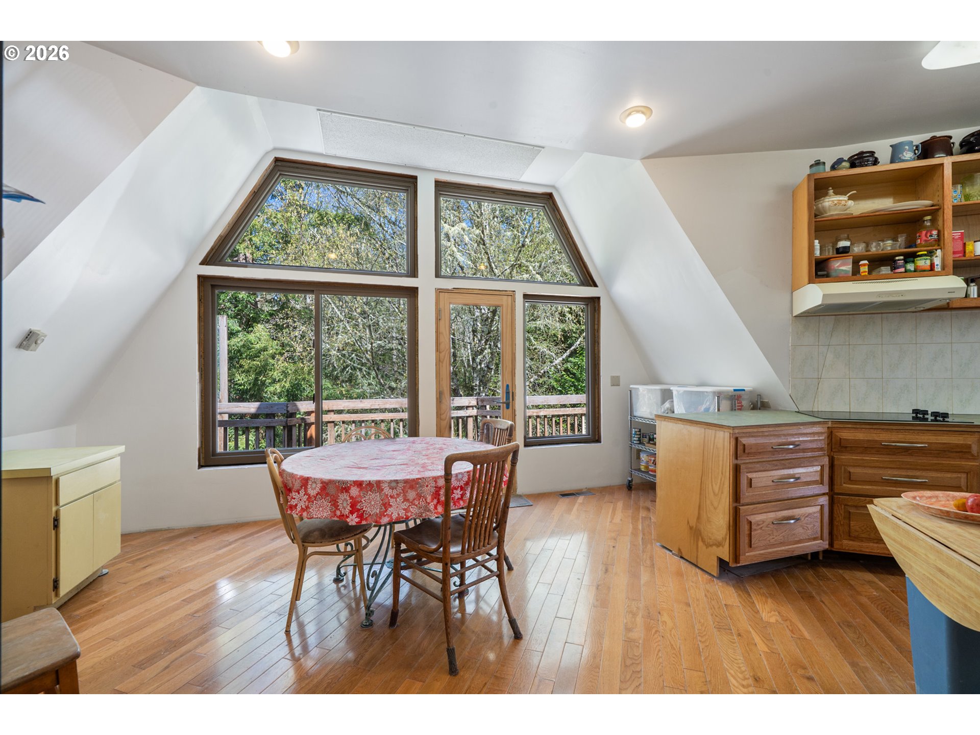 2500 Whiskey Creek Road Tillamook, OR 97141 - Photo 32 of 46 a dining room with furniture and wooden floor