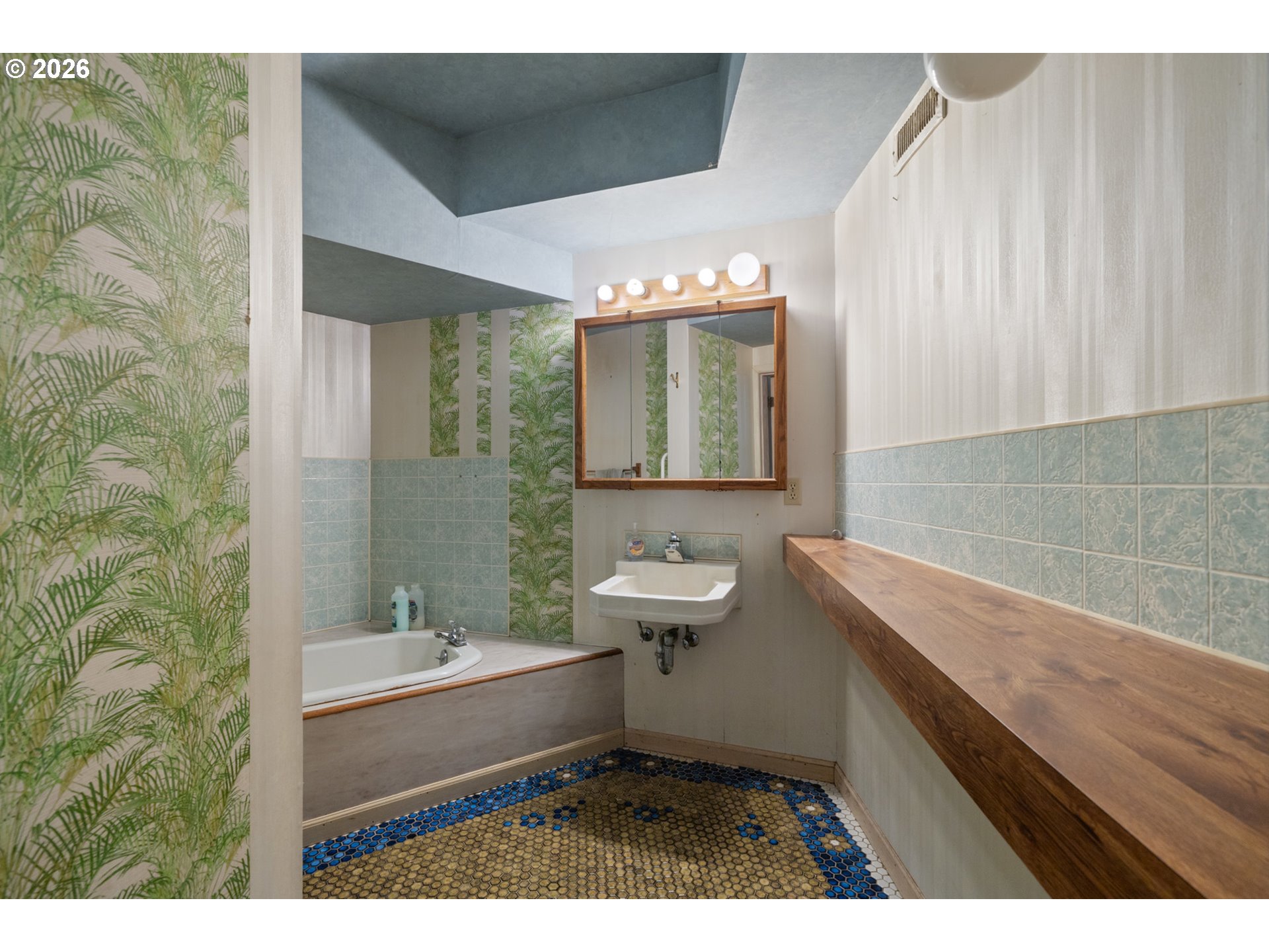 2500 Whiskey Creek Road Tillamook, OR 97141 - Photo 40 of 46 a bathroom with a sink and a mirror