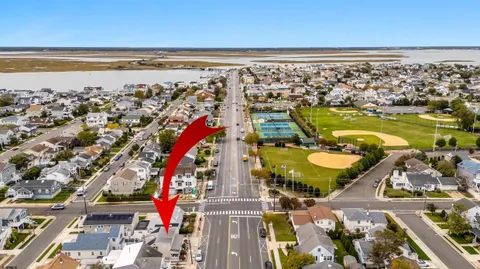 an aerial view of a residential houses with outdoor space