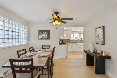 a dining room with furniture and window
