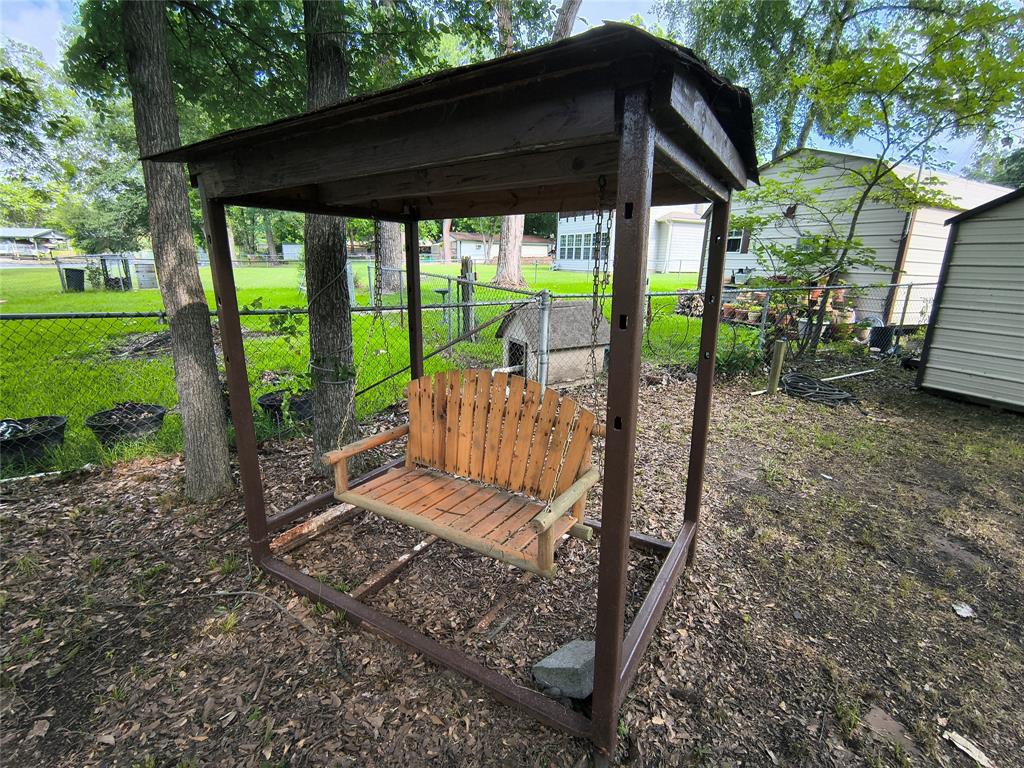 180 Arrowhead Street Mabank, TX 75156 - Photo 22 of 26 a view of a couches in backyard of house