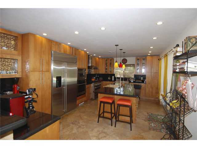 1900 Sharon Street Boca Raton, FL 33486 - Photo 5 of 21 a kitchen with stainless steel appliances kitchen island granite countertop a refrigerator and a sink