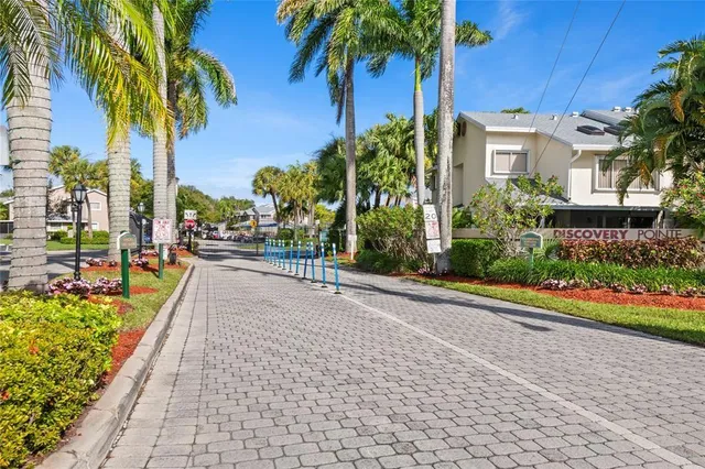 a view of a house with palm trees