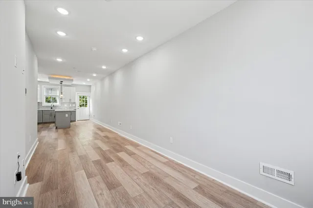 a view of kitchen and wooden floor