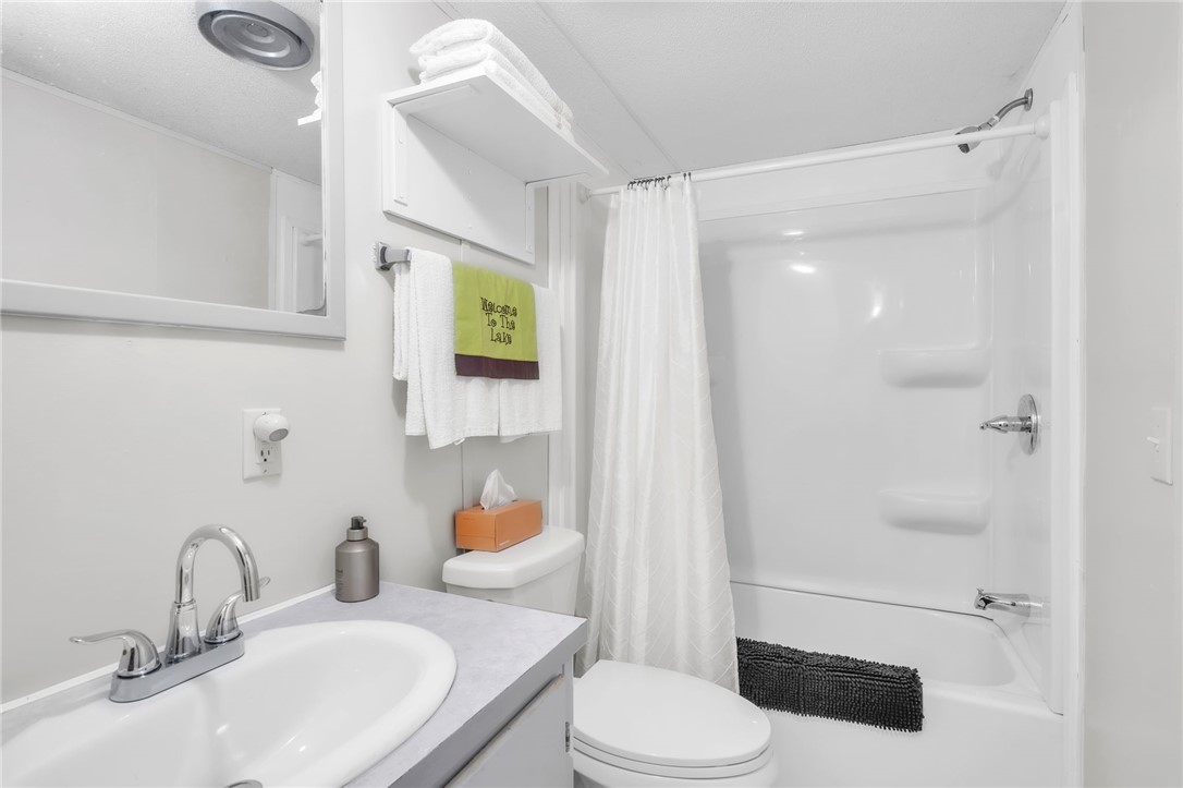 506 Charlies Creek Road Iva, SC 29655 - Photo 16 of 28 A well-appointed bath features a sleek vanity and convenient shower/tub combination.