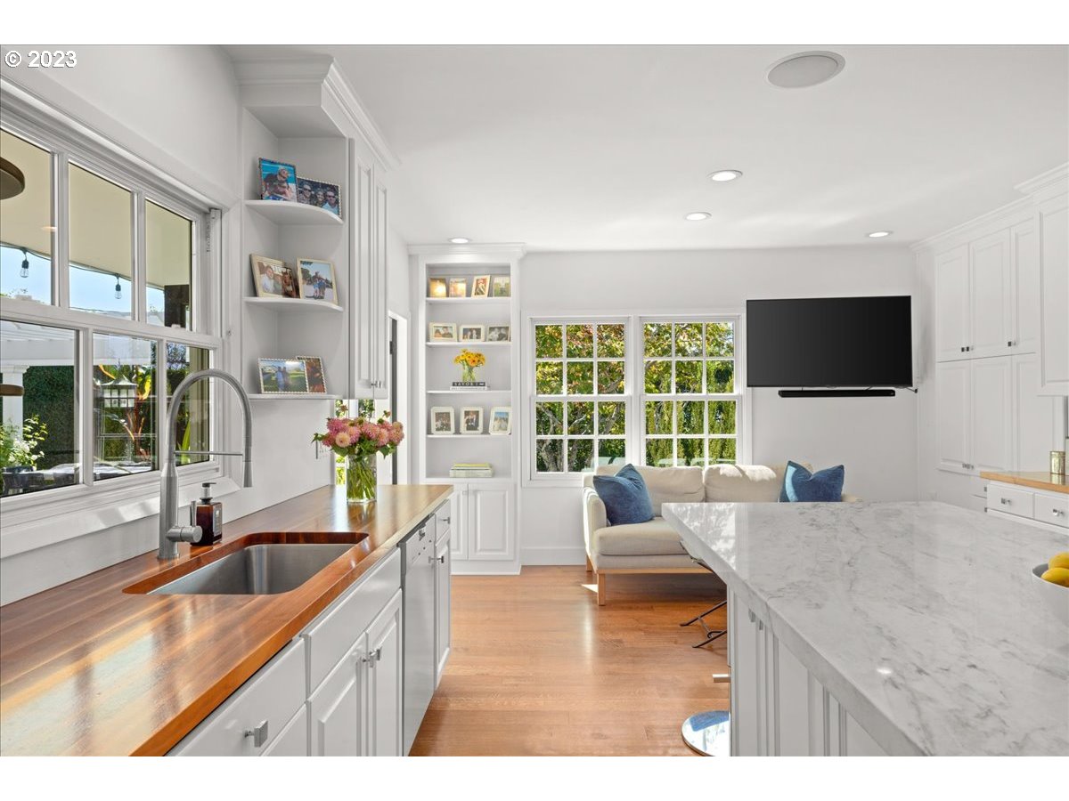 7470 Southwest Westgate Way Portland, OR 97225 - Photo 19 of 41 a kitchen with granite countertop a sink and a counter top space
