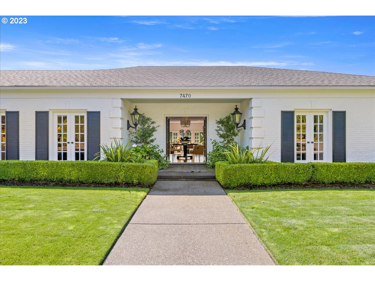 7470 Southwest Westgate Way Portland, OR 97225 - Photo 2 of 41 a view of a brick house with a yard