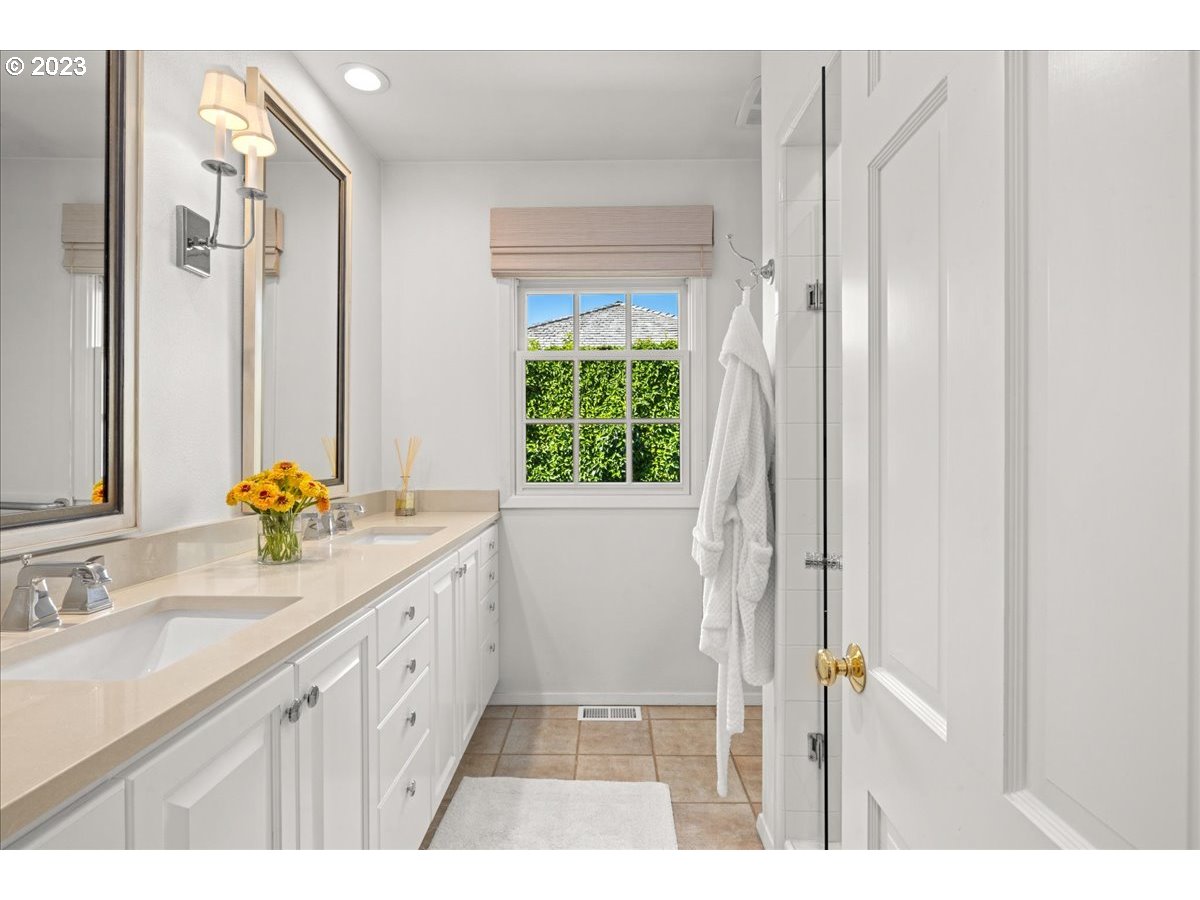 7470 Southwest Westgate Way Portland, OR 97225 - Photo 30 of 41 a bathroom with a double vanity sink and a window