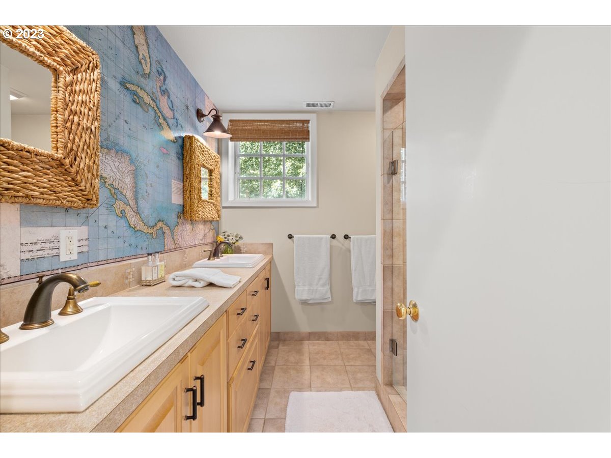 7470 Southwest Westgate Way Portland, OR 97225 - Photo 33 of 41 a bathroom with a sink and a mirror