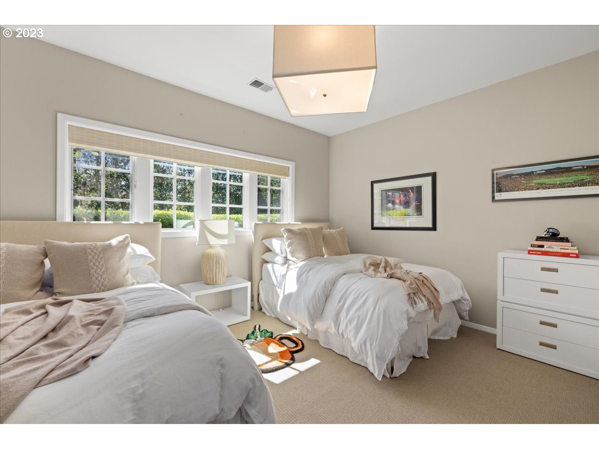 7470 Southwest Westgate Way Portland, OR 97225 - Photo 34 of 41 a bedroom with a bed mirror and window