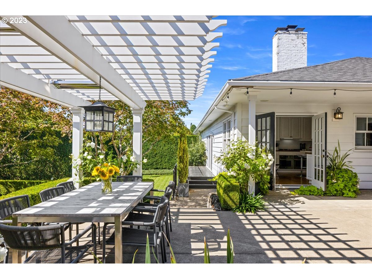 7470 Southwest Westgate Way Portland, OR 97225 - Photo 35 of 41 a view of a patio with table and chairs potted plants