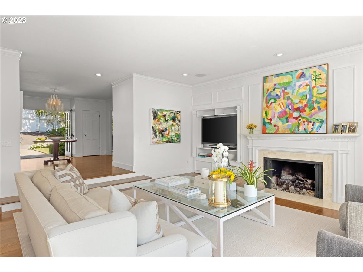 7470 Southwest Westgate Way Portland, OR 97225 - Photo 9 of 41 a living room with furniture a flat screen tv and a fireplace