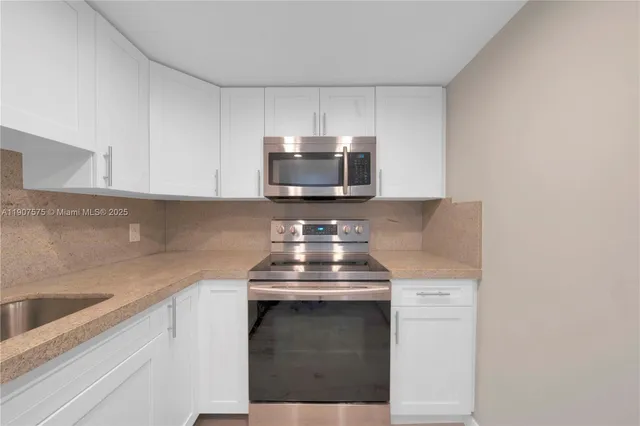 a kitchen with a stove and a sink