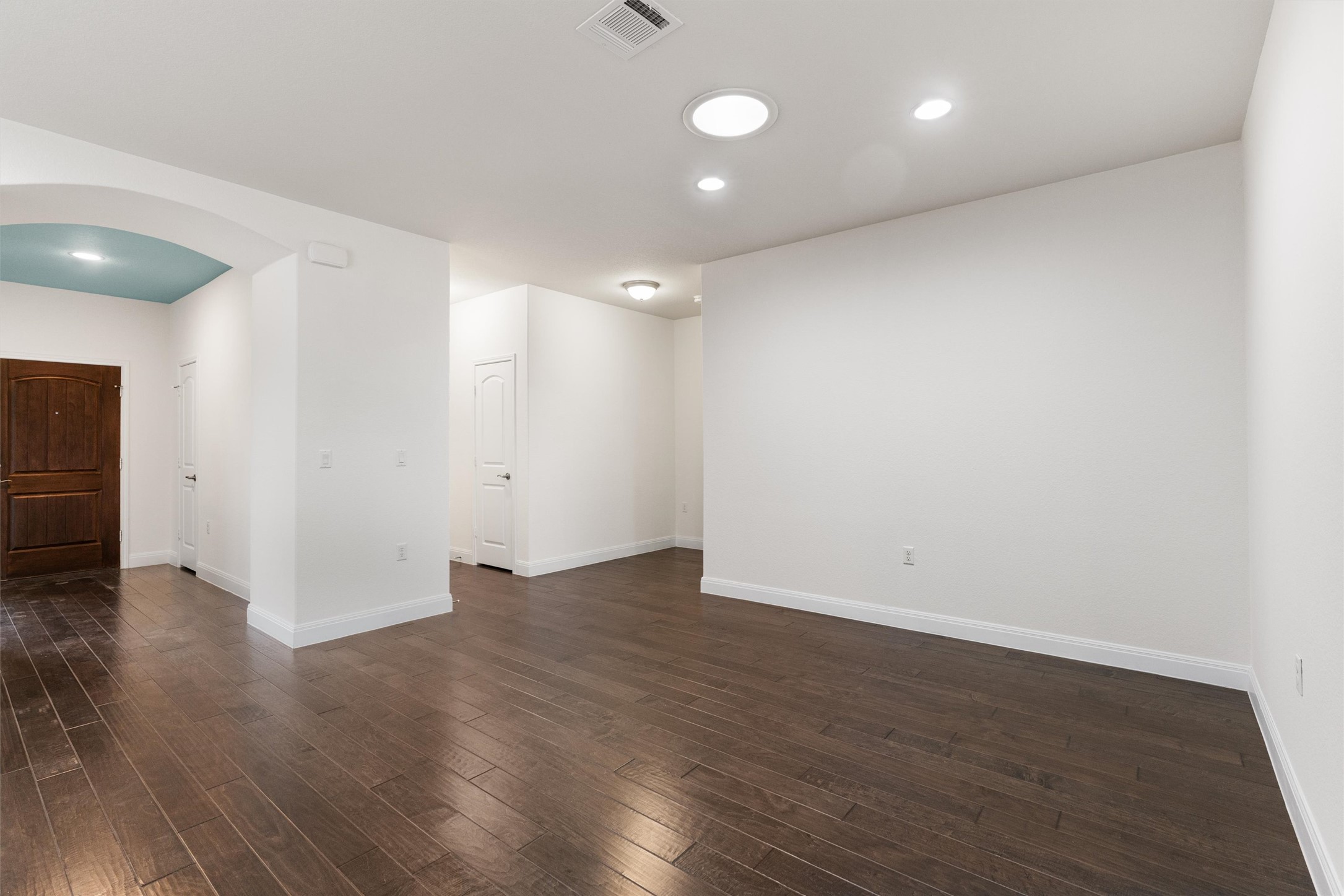706 Kite Ridge Street Georgetown, TX 78633 - Photo 14 of 37 an empty room with wooden floor and windows