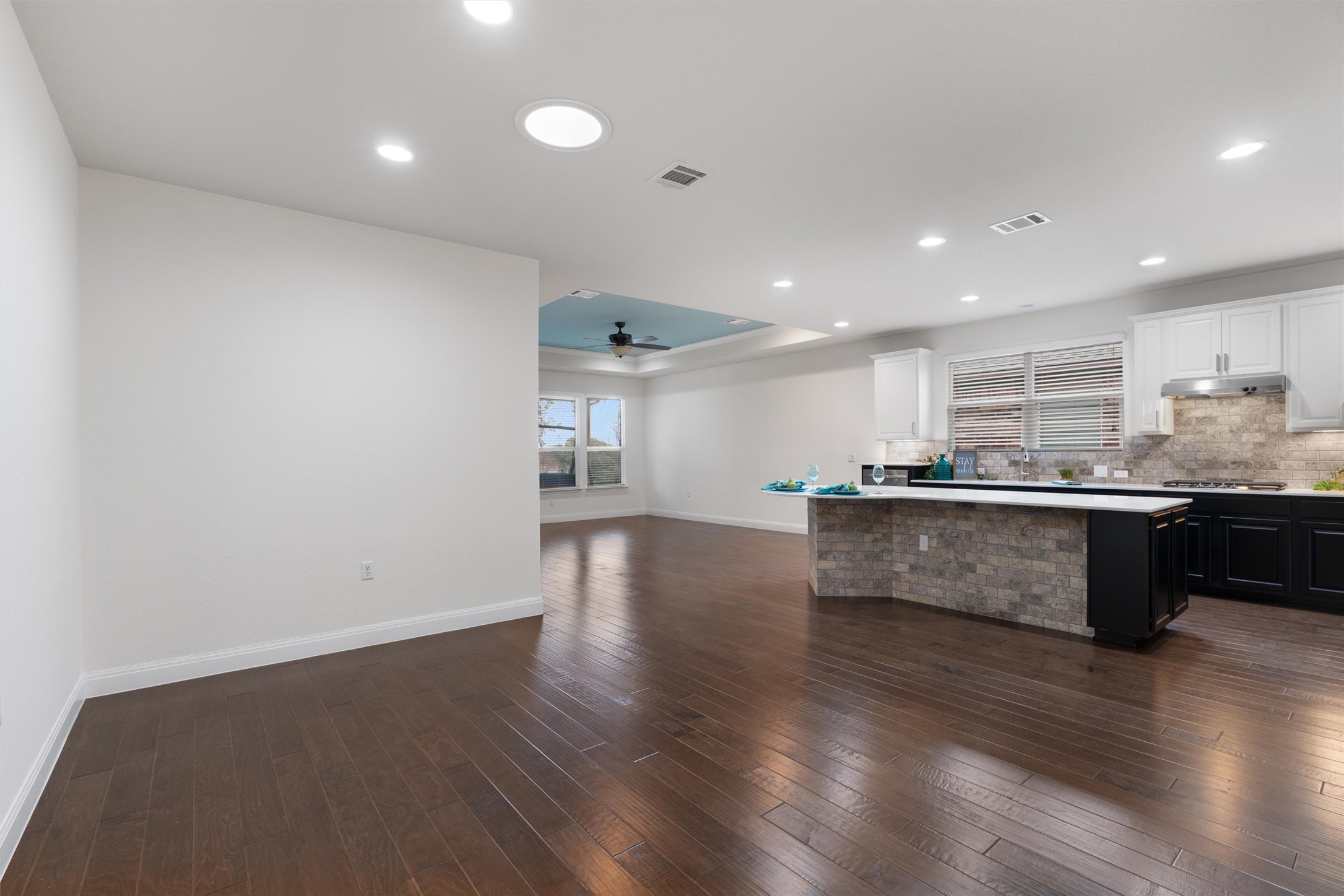 706 Kite Ridge Street Georgetown, TX 78633 - Photo 15 of 37 a large kitchen with stainless steel appliances granite countertop a large counter top a sink and a dishwasher