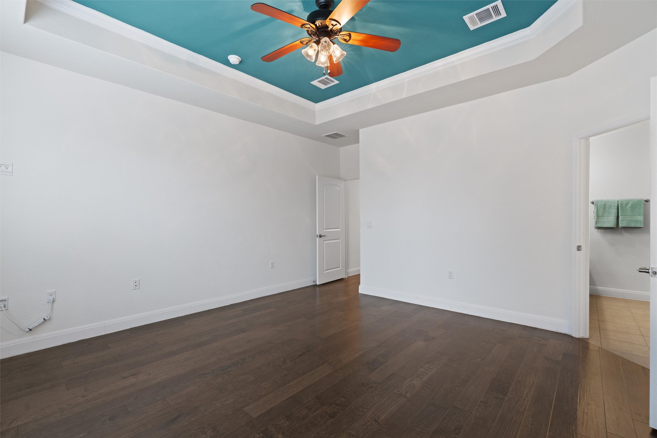 706 Kite Ridge Street Georgetown, TX 78633 - Photo 20 of 37 a view of an empty room with window and wooden floor