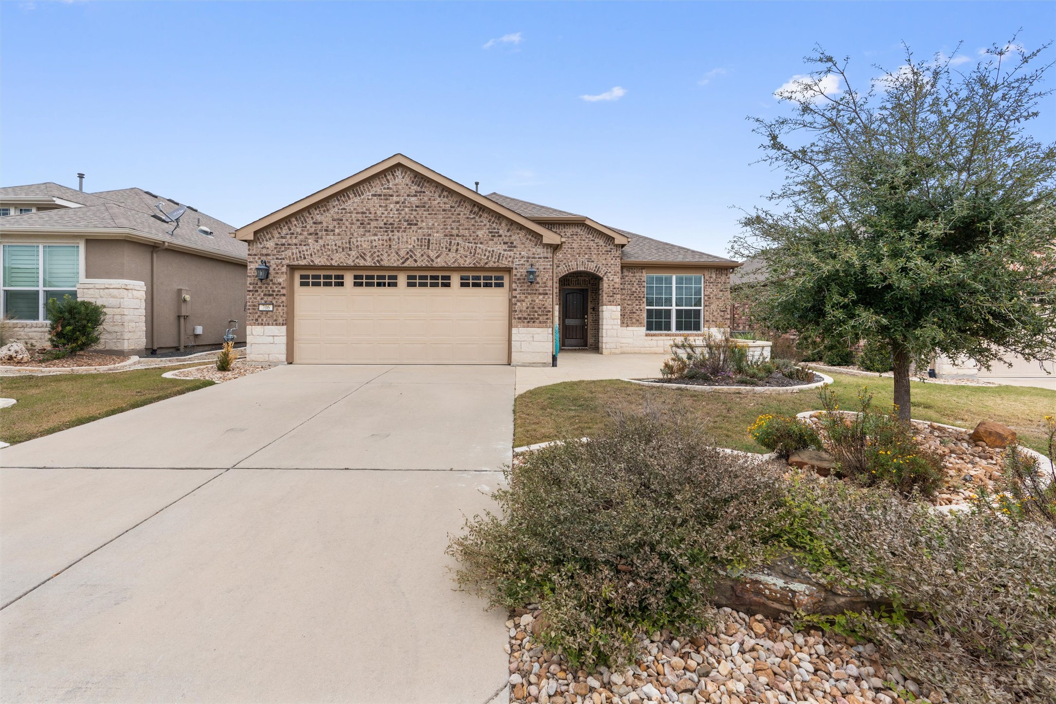 706 Kite Ridge Street Georgetown, TX 78633 - Photo 2 of 37 a view of a house with a yard and large tree
