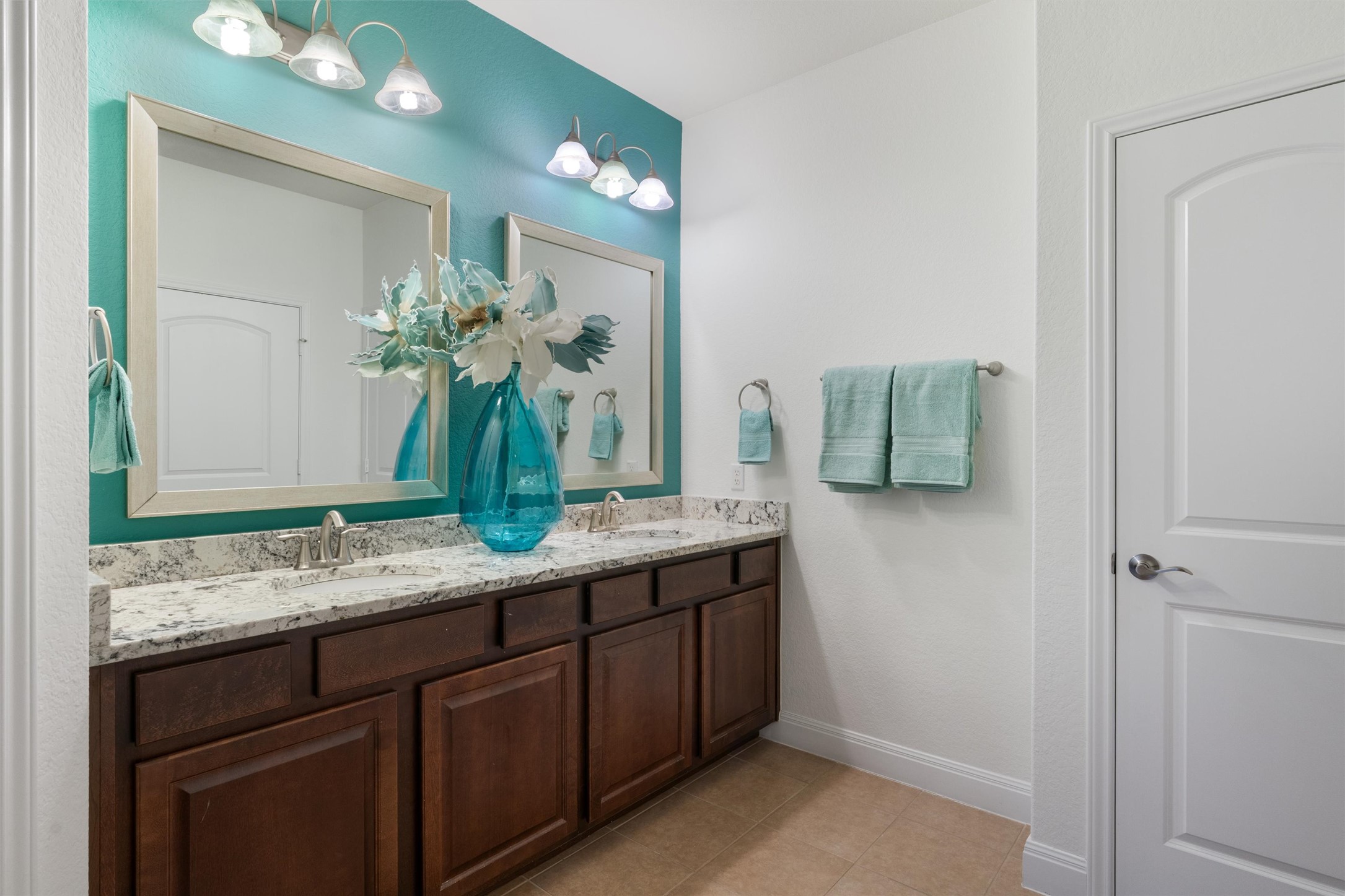 706 Kite Ridge Street Georgetown, TX 78633 - Photo 21 of 37 a bathroom with a granite countertop sink and a mirror