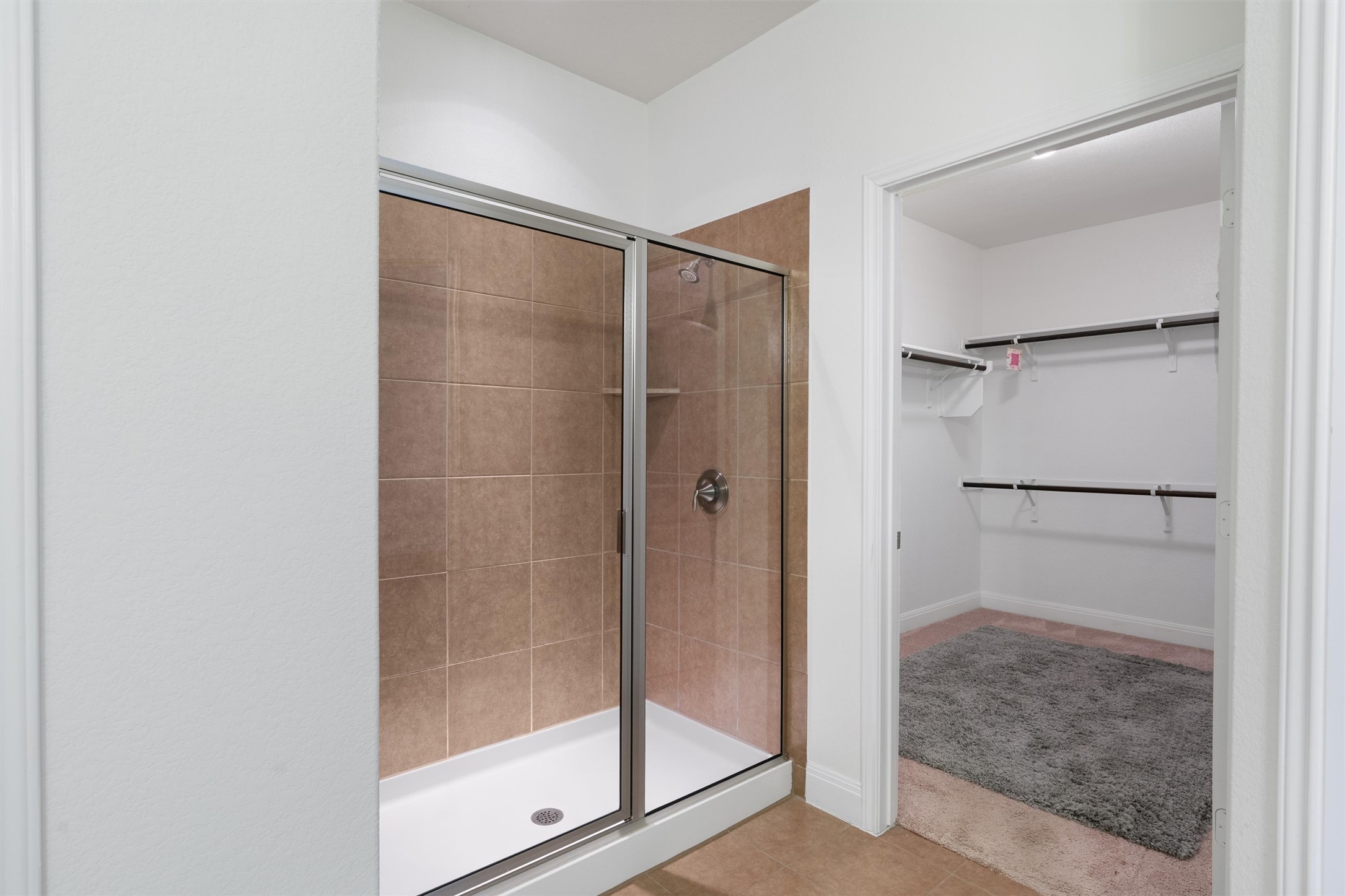 706 Kite Ridge Street Georgetown, TX 78633 - Photo 22 of 37 a bathroom with a glass shower door