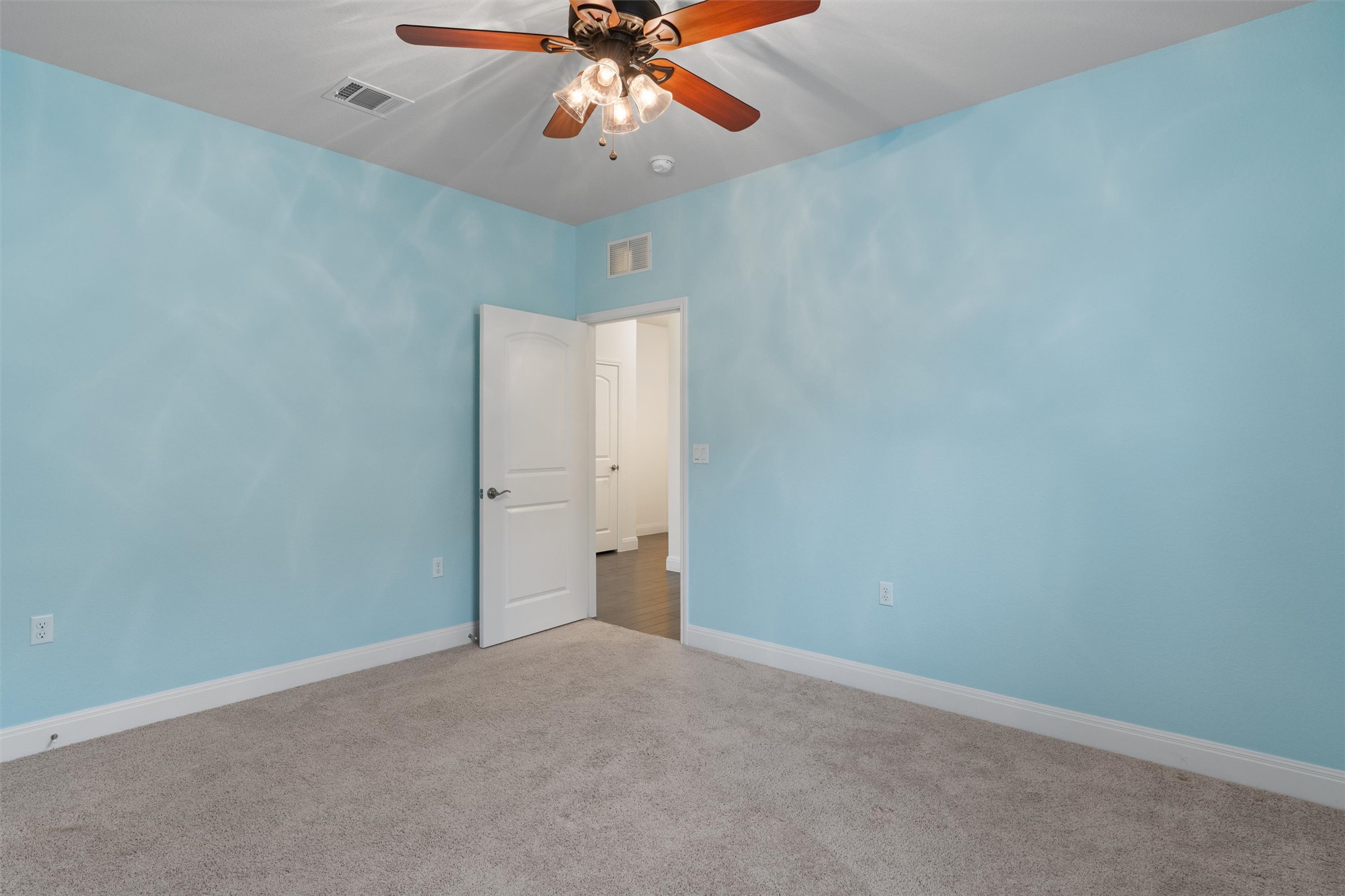 706 Kite Ridge Street Georgetown, TX 78633 - Photo 25 of 37 an empty room with a fan and a chandelier fan