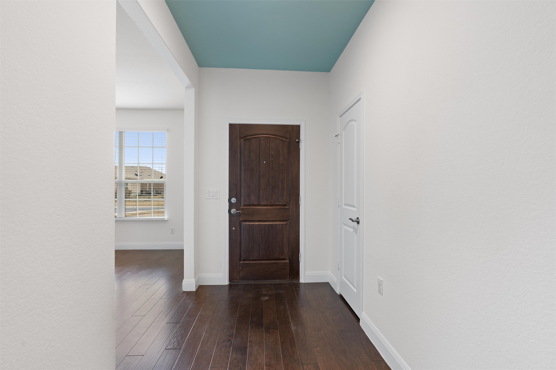 706 Kite Ridge Street Georgetown, TX 78633 - Photo 4 of 37 a view of a hallway with wooden floor