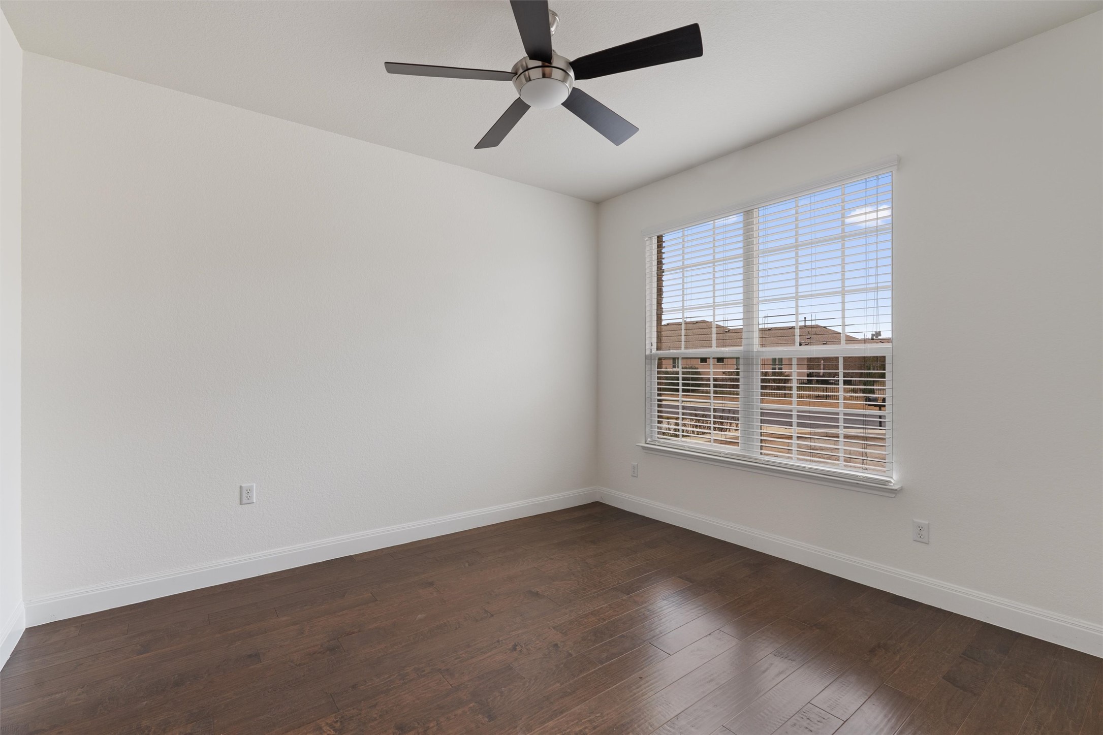 706 Kite Ridge Street Georgetown, TX 78633 - Photo 5 of 37 an empty room with a window and a ceiling fan